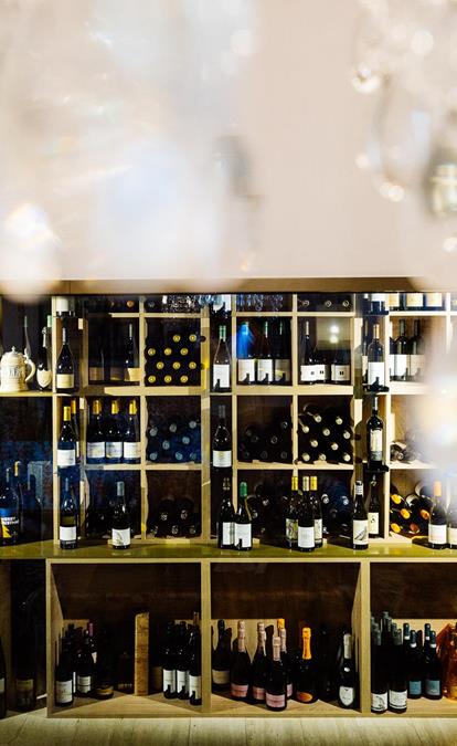 A shelf full of wine bottles